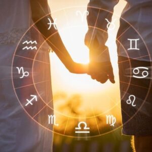 couple holding has with horoscope zodiac signs in the sun