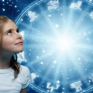 a girl looking at horoscope with zodiac signs like astrology and child, children, kids concept